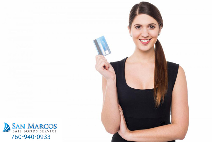 attractive-woman-displaying-her-credit-card (2)(1)